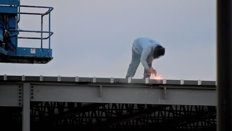 Construction-Working-Welding-on-Roof