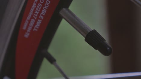 Handheld-Closeup-of-Bike-Valve-UHD