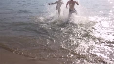 Two-Men-Running-into-Lake