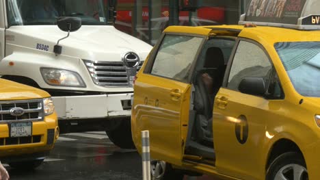 Lady-Getting-Into-Taxi-in-Rain-in-New-York-