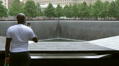 Man-Looking-Over-911-Memorial-New-York