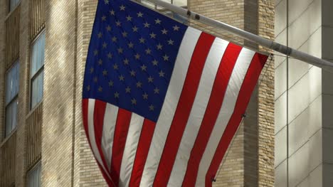 Close-Up-of-USA-Flag-Flying-on-Wall-Street