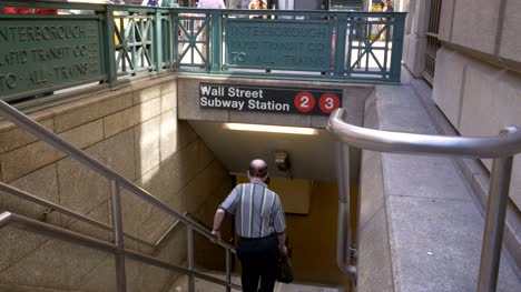Elderly-Man-Going-into-Wall-Street-Subway-Station