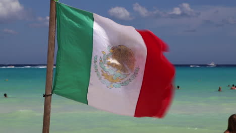 Mexican-Flag-Flying-On-Beach