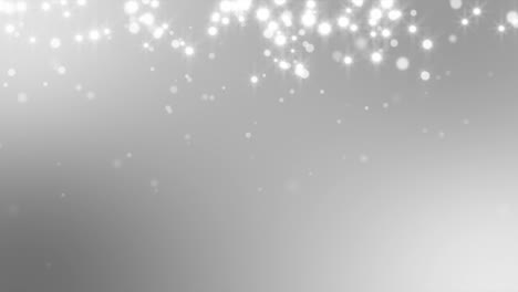 White-Sparkles-Against-Silver-Background-Loop