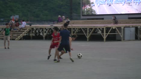 Men-Playing-Soccer-in-Street-3