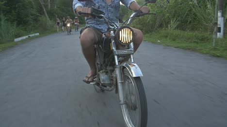 Man-Riding-a-Scooter-Through-Vietnamese-Countryside