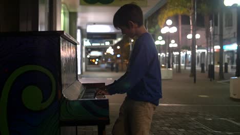 Young-Boy-Playing-Piano-in-the-Street