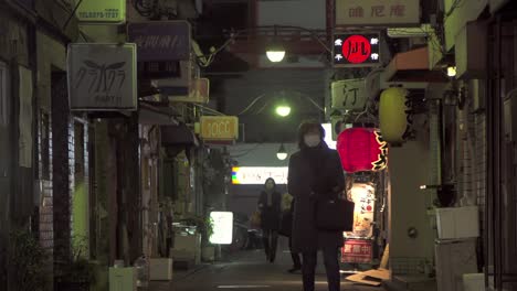 Lady-Walking-Down-Dark-Japanese-Street