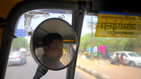 Tuk-Tuk-Drivers-Reflection-in-Wing-Mirror