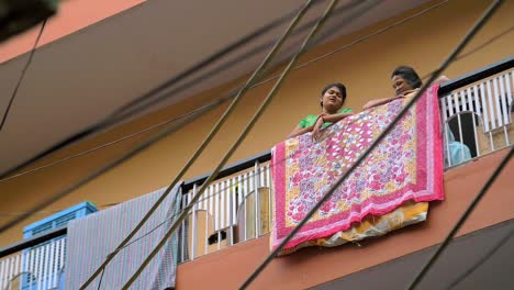 Indian-Girl-and-Woman-Talking-on-a-Balcony