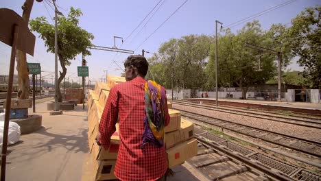 Men-Moving-a-Cart-Along-a-Railway-Platform