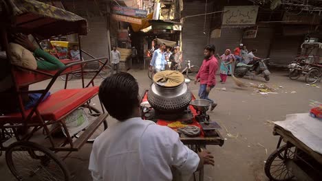 Man-Pushing-Cart-onto-Busy-Indian-Road