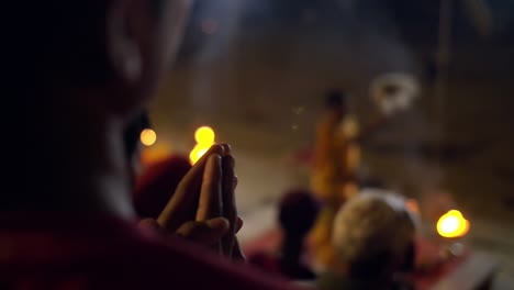 Man-Praying-at-Nighttime-Ceremony