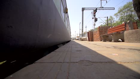 Train-Moving-Alongside-Railway-Platform