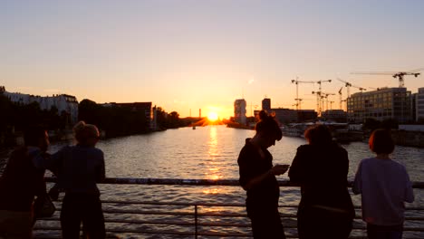Tourists-Overlooking-Berlin-Cityscape-at-Sunset