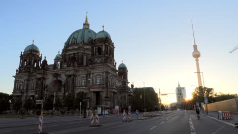 Cyclist-Passing-the-Berlin-Cathedral-at-Sunrise