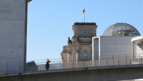 Man-Overlooking-Reichstag-Building