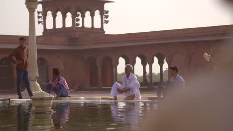 Reveal-Shot-of-People-Bathing-at-Jama-Masjid