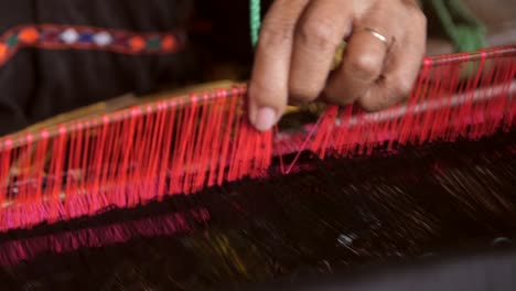 Close-Up-Shot-of-a-Woman-Weaving