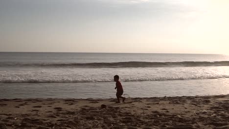 Small-Boy-Running-in-Slow-Motion-on-a-Beach