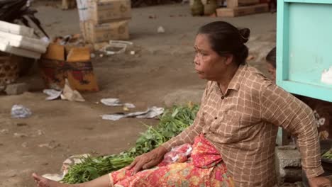 Elderly-Indonesian-Woman-Sitting-on-the-Ground