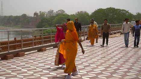 Slow-Motion-Shot-of-Two-Women-in-Saris-Walking