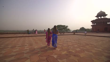 Two-Women-in-Saris-Walking-Away