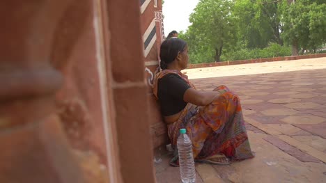 Reveal-Shot-of-Elderly-Indian-Woman-Sitting
