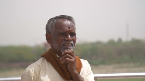 Elderly-Indian-Man-Rubbing-His-Beard
