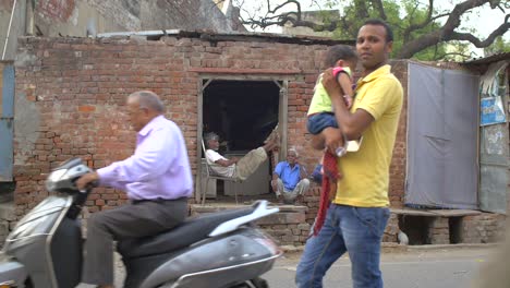 Two-Indian-Men-Sitting-in-a-Doorway