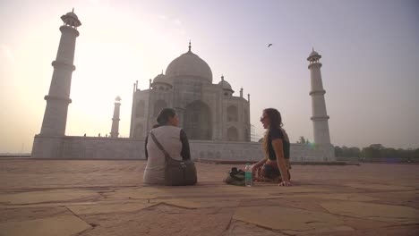 Two-Women-Sitting-by-the-Taj-Mahal