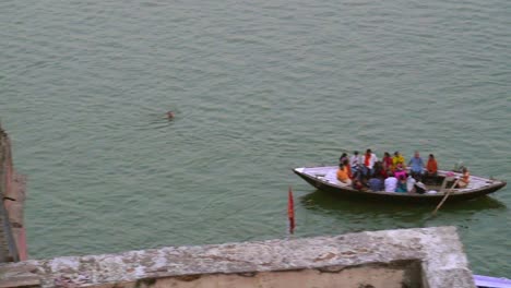 Panning-Shot-of-Rowing-Boats-on-the-Ganges