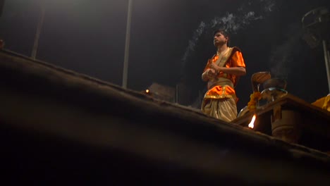Indian-Man-Waving-Incense-and-Ringing-a-Bell