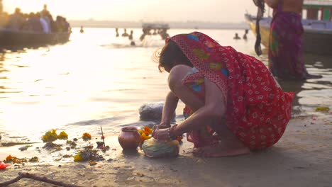 Crouching-Indian-Woman-Sorts-Marigold-Flowers