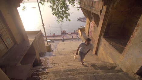 Man-Climbing-Steps-Away-from-the-River-Ganges