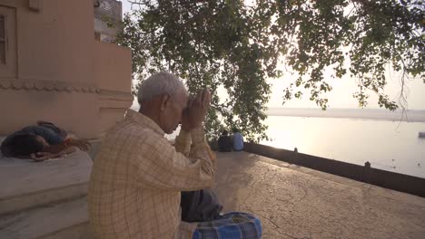 Elderly-Man-Praying-Near-the-Ganges