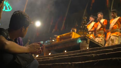 Man-Clapping-Along-to-Ganga-Aarti-Ceremony