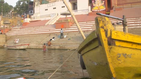 Panning-Shot-of-Yellow-Boat-and-Ghat