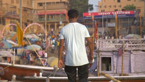 Indian-Man-Standing-on-a-Rowing-Boat