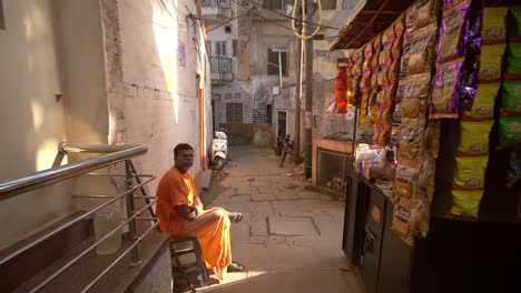Indian-Man-Sitting-in-an-Alleyway