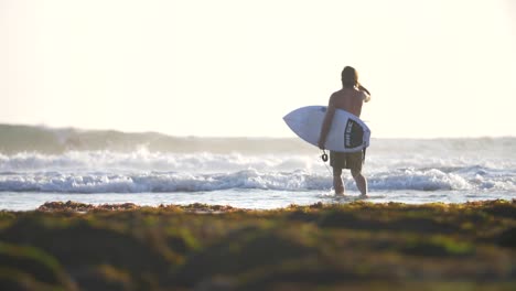 Surfer-Entering-the-Ocean