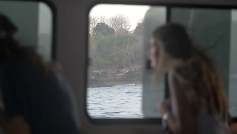 Woman-Looking-Out-Boat-Window