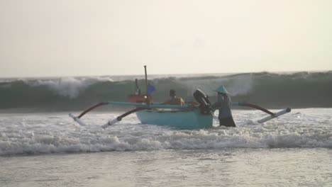 Pushing-a-Fishing-Canoe-Into-the-Waves