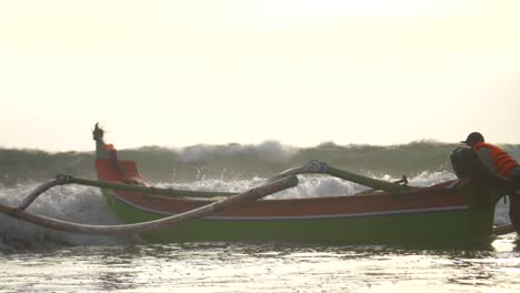 Waves-Hitting-a-Fishing-Canoe-on-a-Beach
