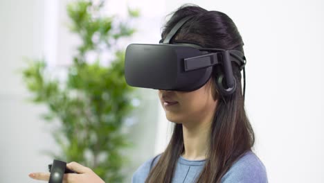 Young-Lady-Looking-Around-in-VR-Headset