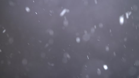 Slow-Motion-Snowfall-On-Black-Background