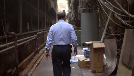 Businessman-Walking-in-Dirty-Alley
