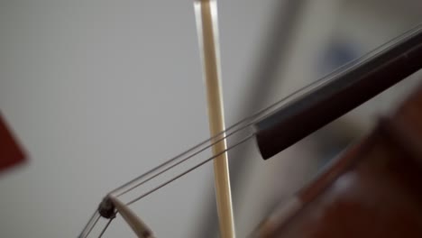 Bow-on-Cello-Strings-Close-Up