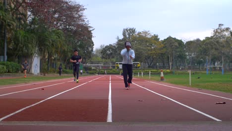 Low-Level-Shot-of-Runners-on-a-Track